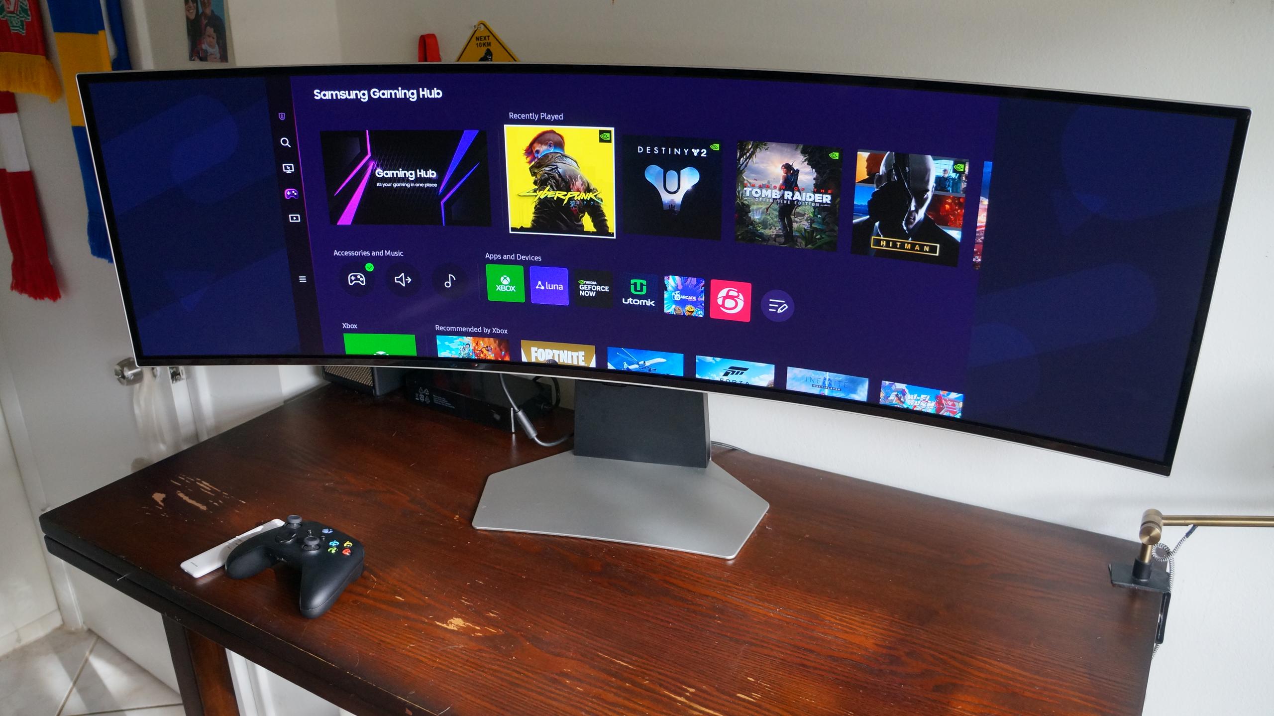 Samsung Odyssey OLED G9 49-inch Gaming Monitor on a Brown Desk

