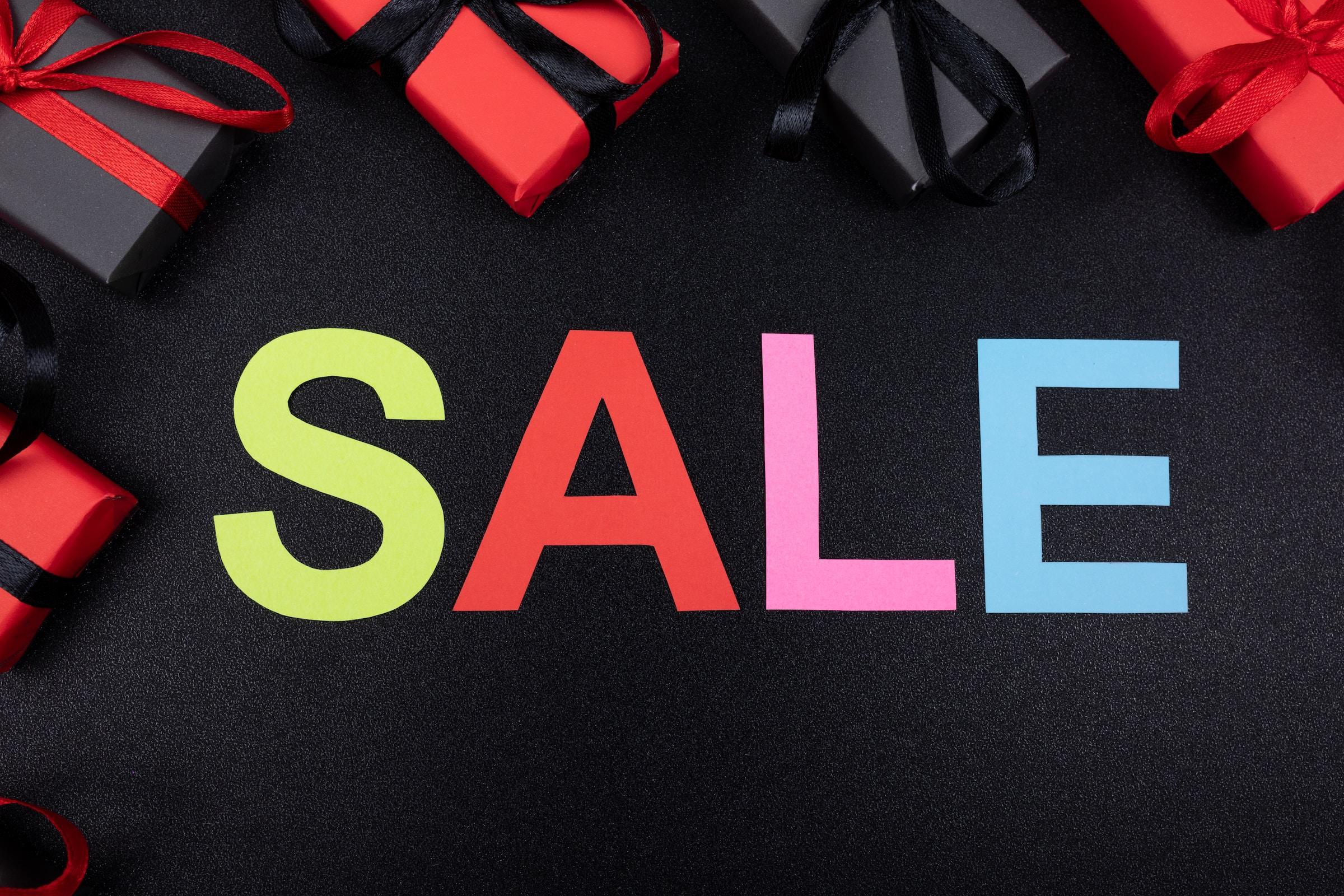 Sale Sign in Colorful Letters on a Black Background
