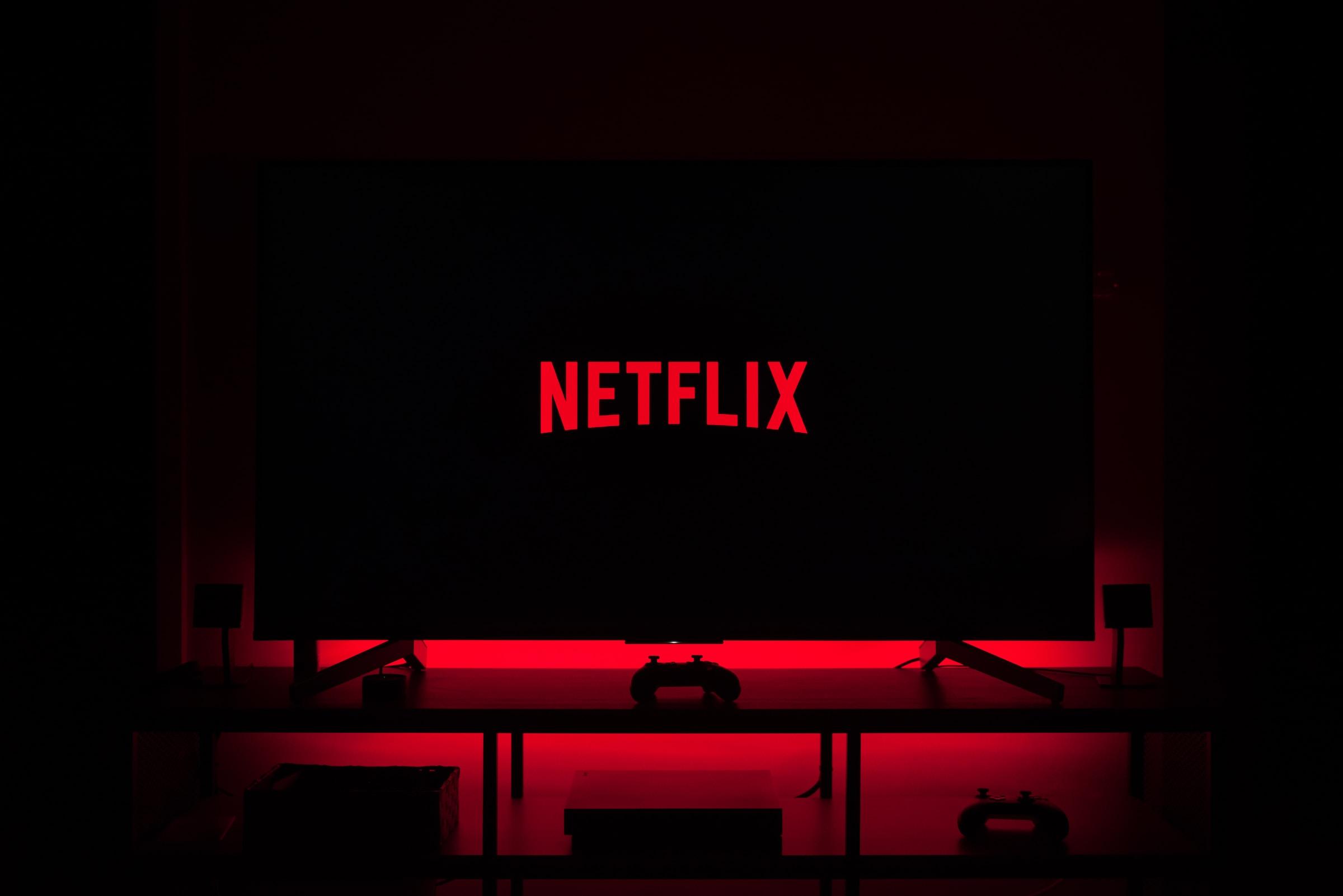 Dark Room with a big TV playing Netflix