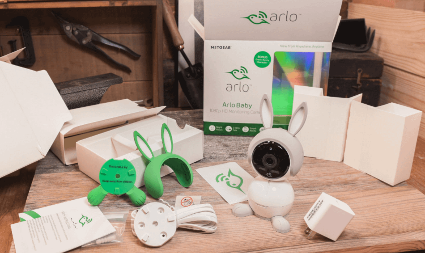 The picture shows the Arlo Baby Monitor and all of its equipment on the table