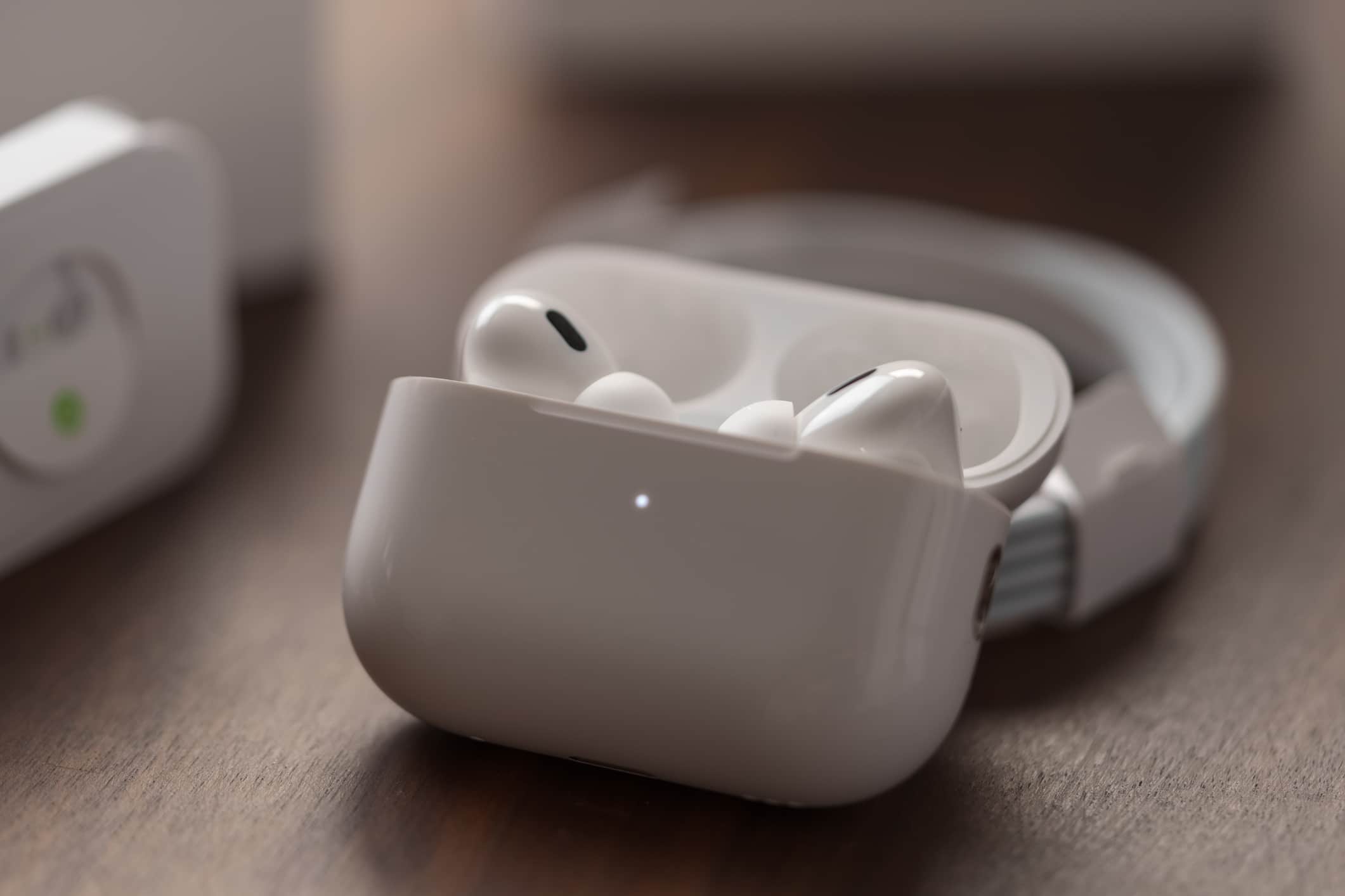 Apple AirPods earbuds in charging case.