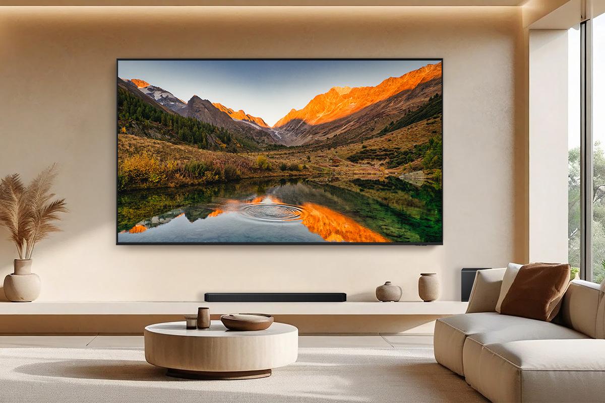 Samsung 115-inch QN90F TV in living room.
