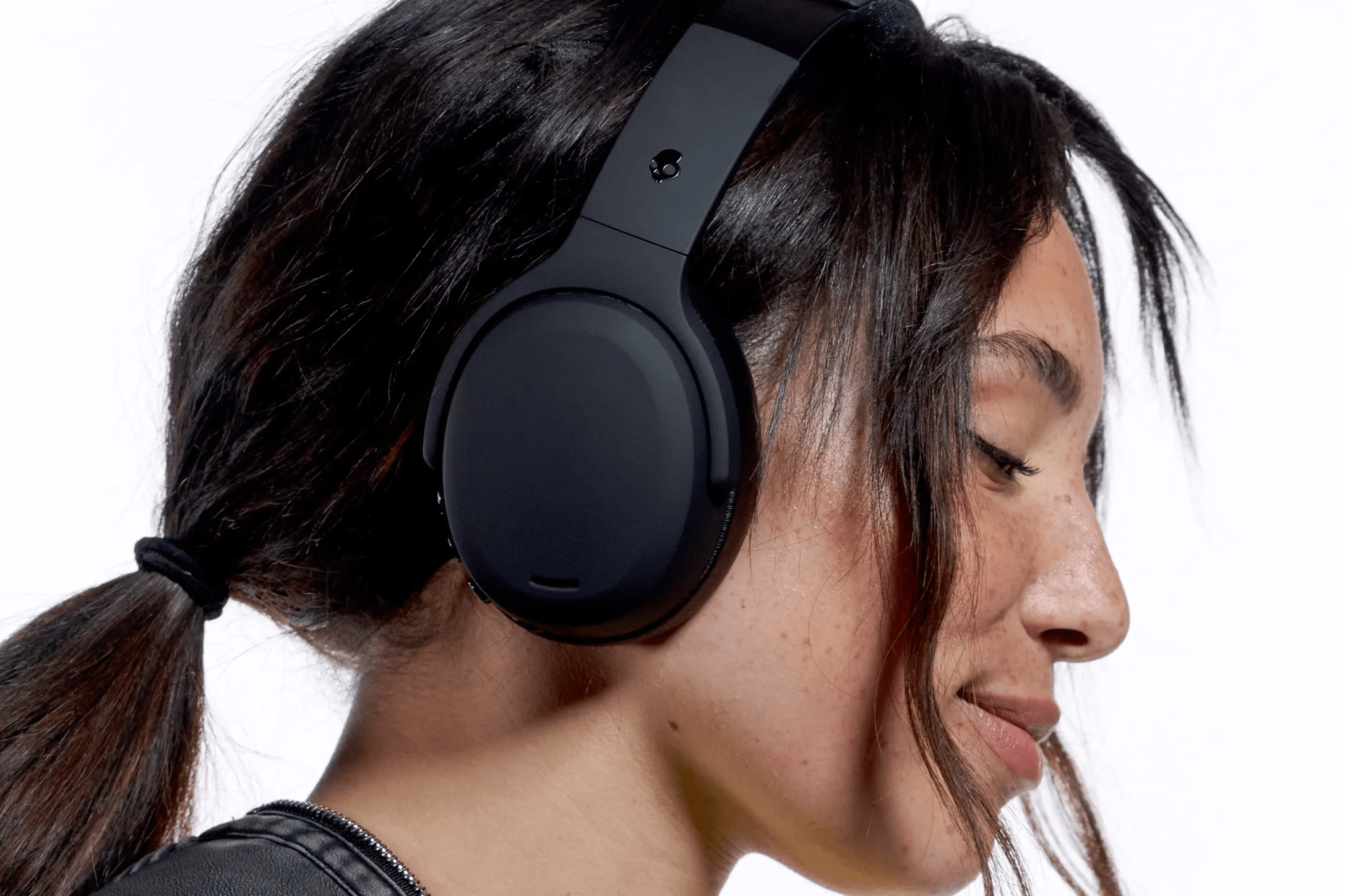These Skullcandy Headphones Shake My Skull—in the Best Way (38% Off Before Prime Day) 2 Woman wearing Skullcandy Crusher ANC 2 headphones.