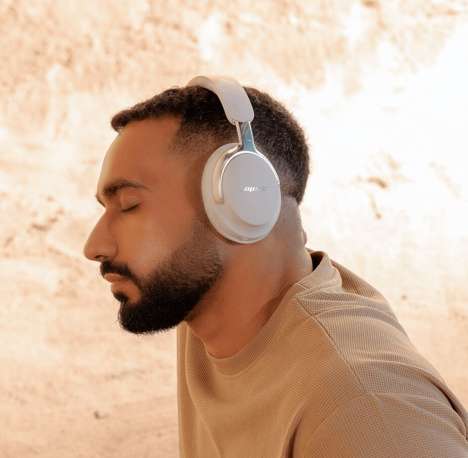 Bose QuietComfort Ultra 2nd Gen: The Headphones Everyone Will Be Talking About This Fall 3 Man wearing Bose QuietComfort Ultra 2nd Gen headphones in White Smoke color.