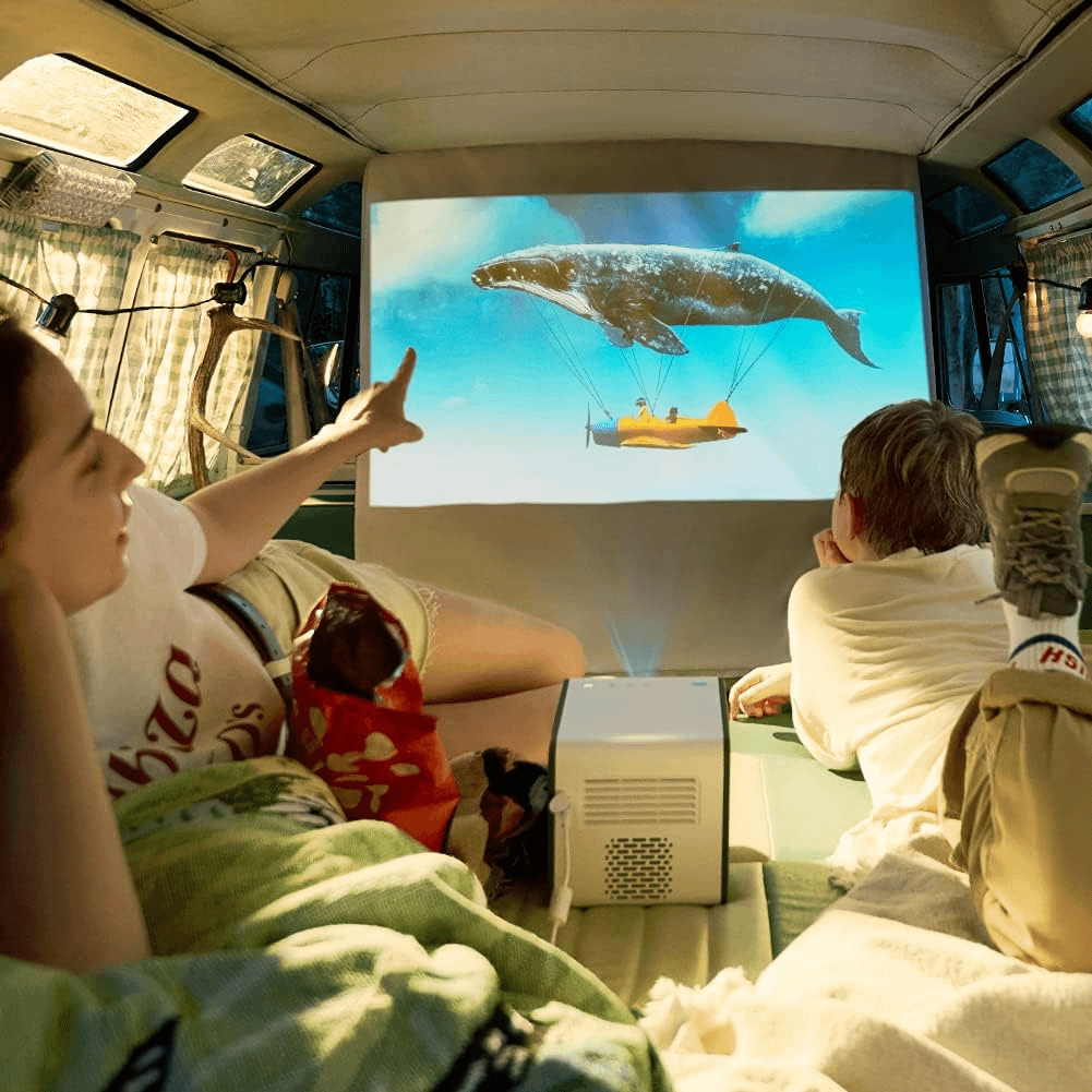 This BenQ Portable Projector Blew Me Away—And It’s 31% Off Ahead of Prime Day 2 BenQ GS50 Outdoor Projector in a van.