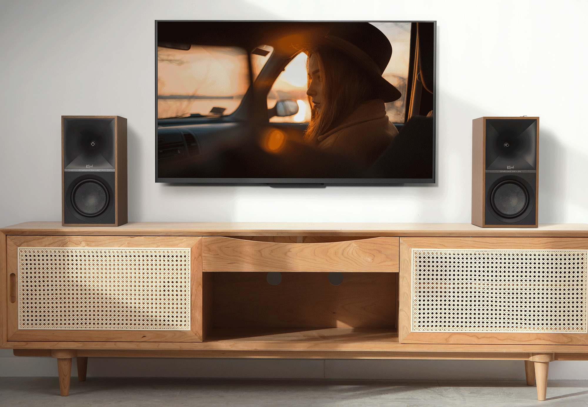Klipsch The Sevens Heritage Inspired powered speakers on TV console.
