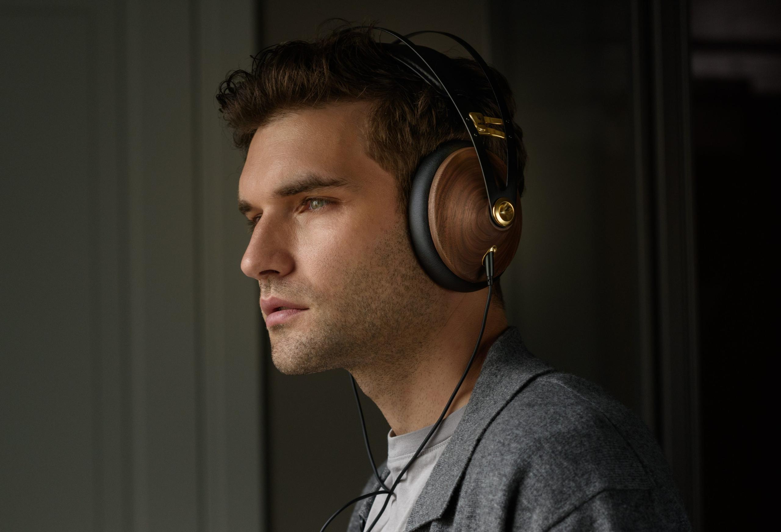 Man wearing Meze 99 Classics Gen 2 headphones.