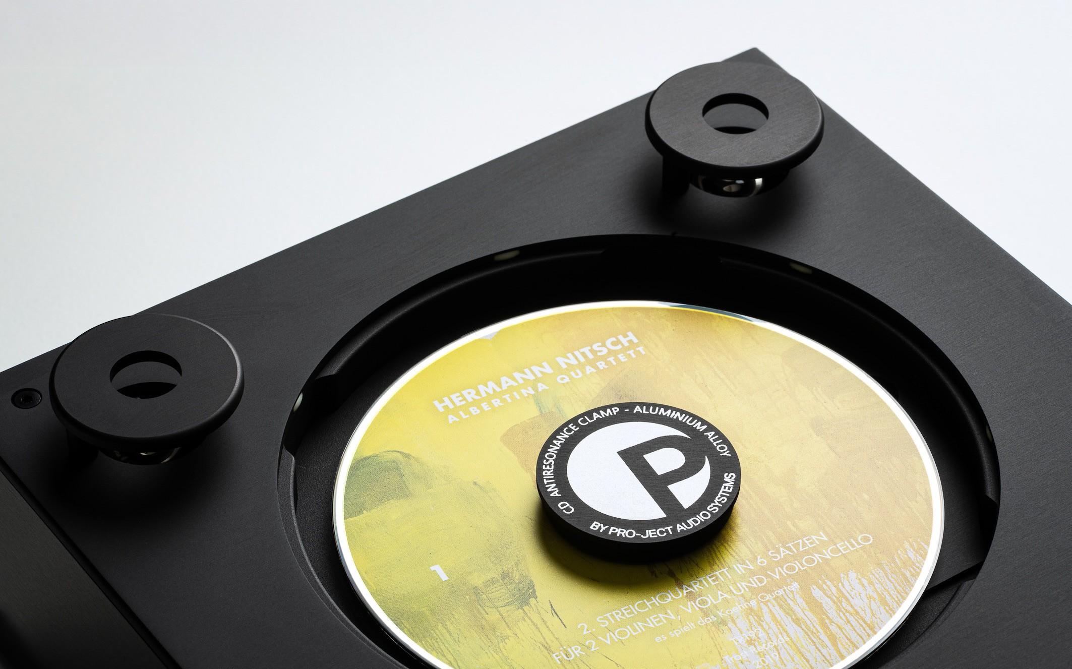 Top-loading Pro-Ject CD Box RS2 Tube with aluminum clamp and compact disc in place.