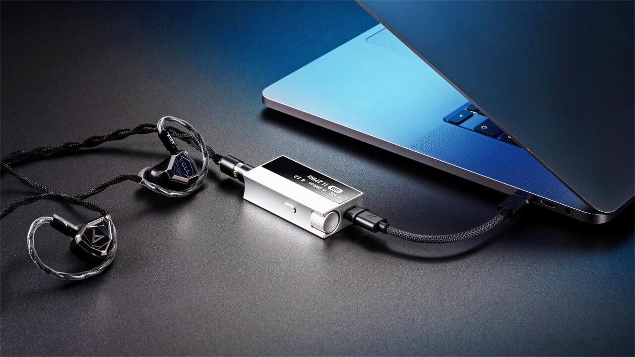 Astell & Kern HC5 DAC & Stella IEMs connected to laptop.