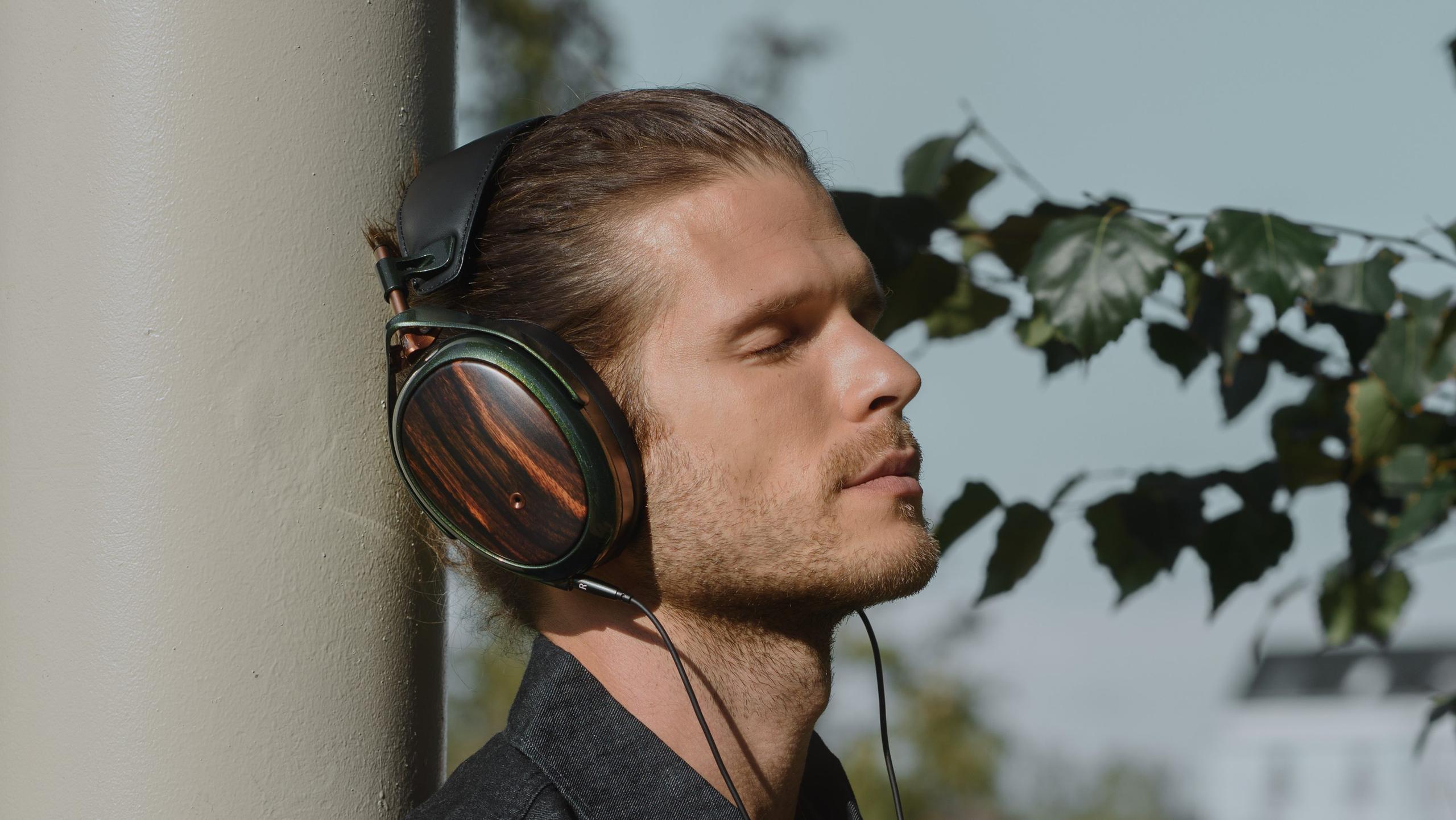Person wearing Meze Strada headphones.
