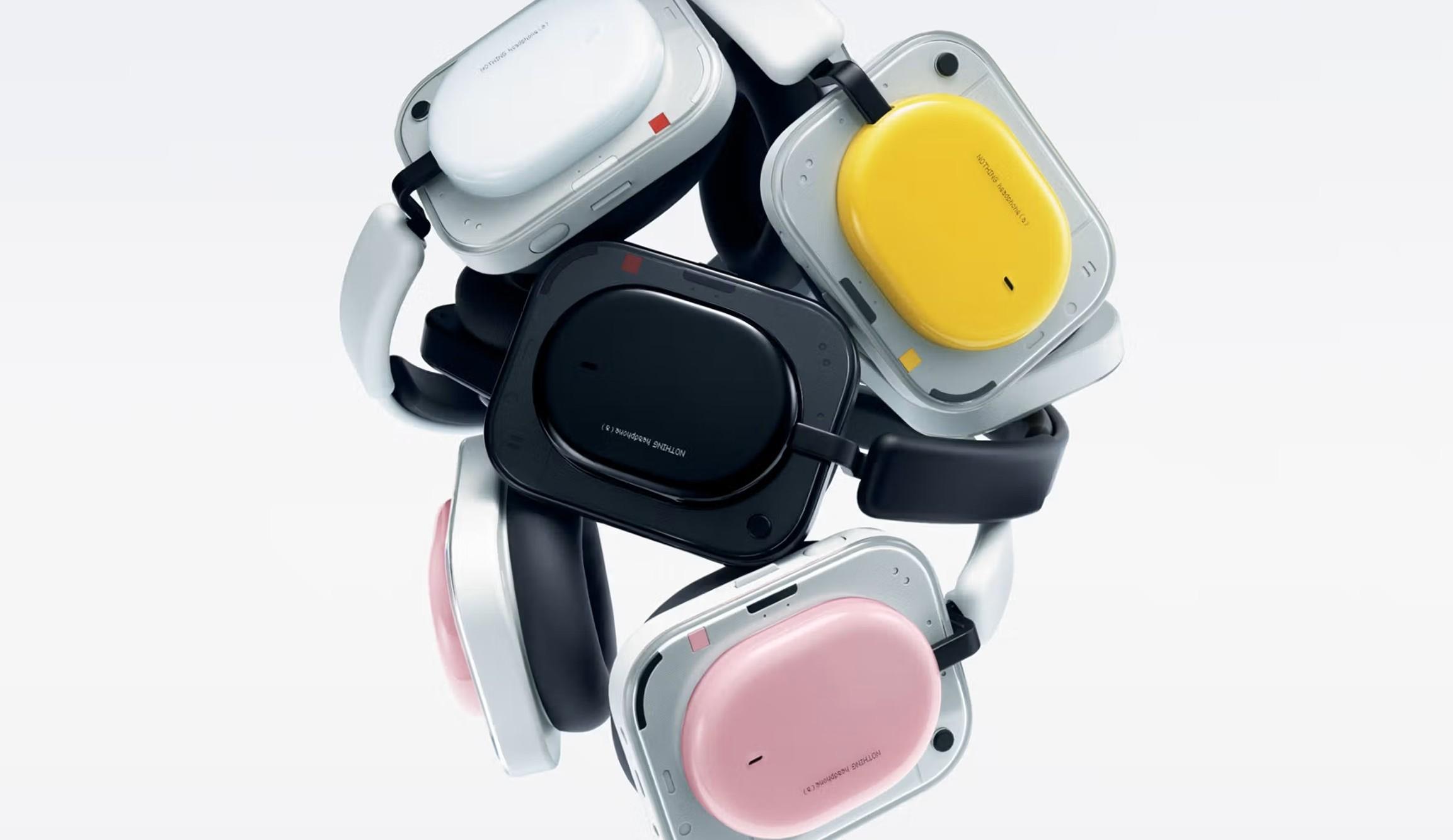 Nothing Headphone (a) wireless over-ear headphones shown in black, white, pink, and yellow color options stacked together.