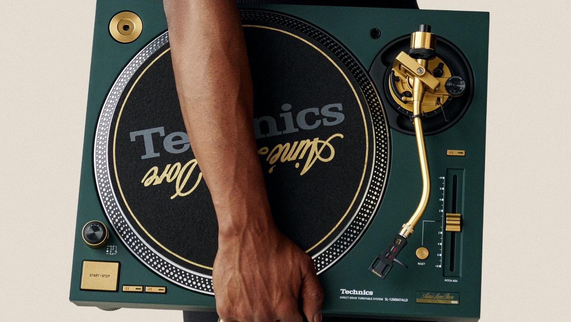 Technics SL-1200M7ALD turntable in mulberry green with gold tonearm and branding.